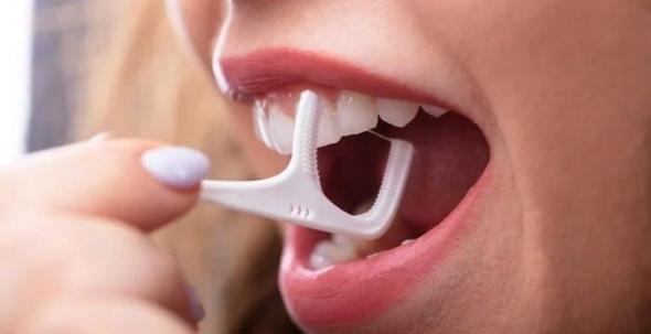 زمان استفاده از نخ دندان